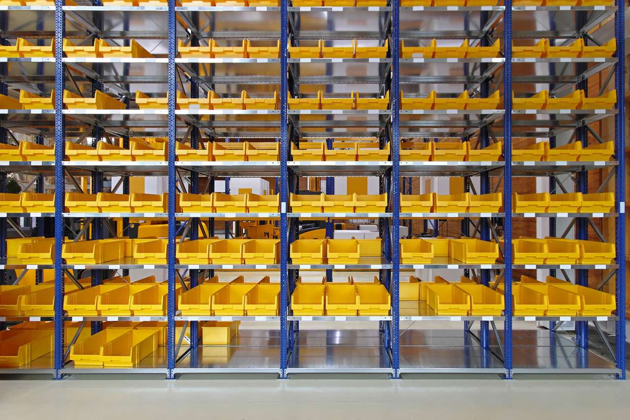bins in racks bins on a shelf in a general manufacturing facility