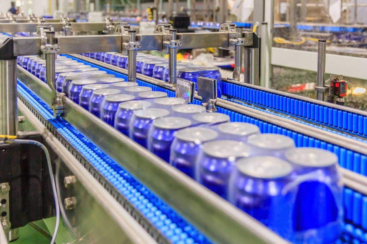 shrink wrapped cans on conveyor soda cans on a beverage line